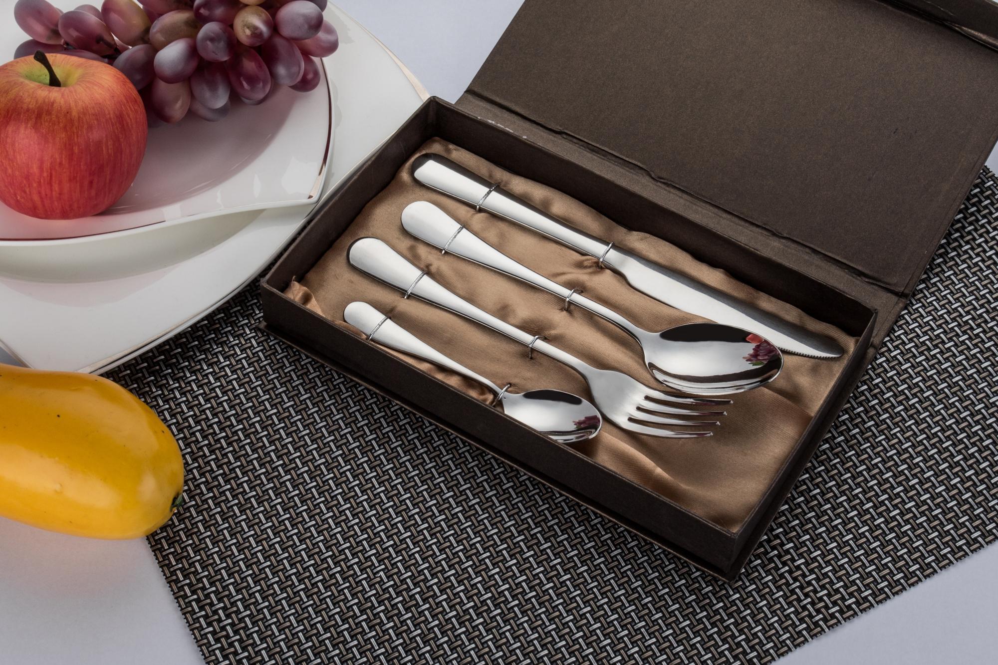 Display of three culinary packages on elegant paper